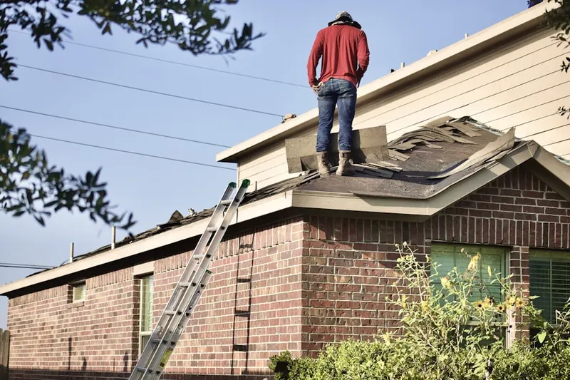 Professional roofer working on a residential roof in Washoe Valley